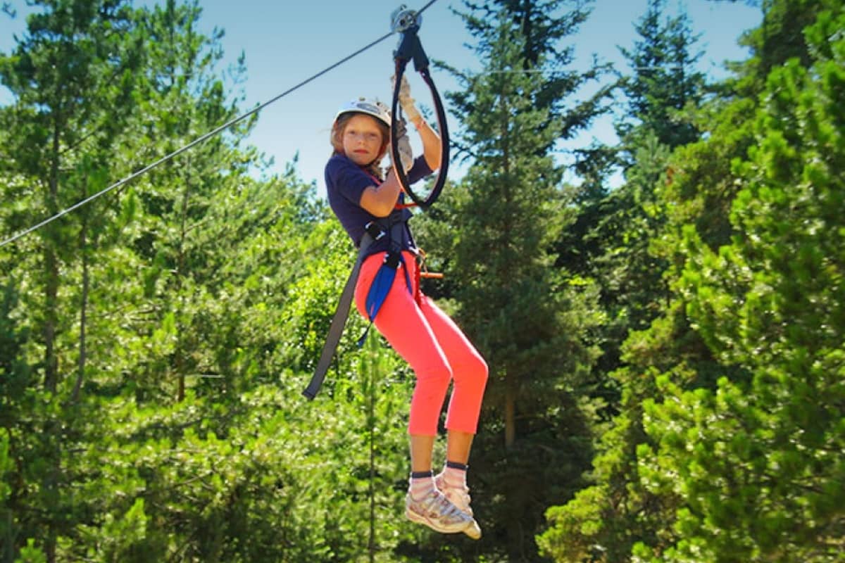 Girl riding a zipline