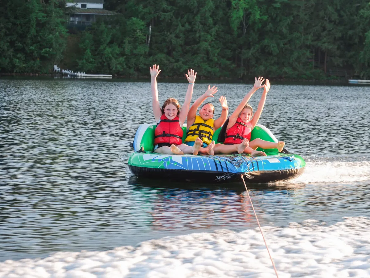 Campers tubing on the lake at Berkshire Trails Camp
