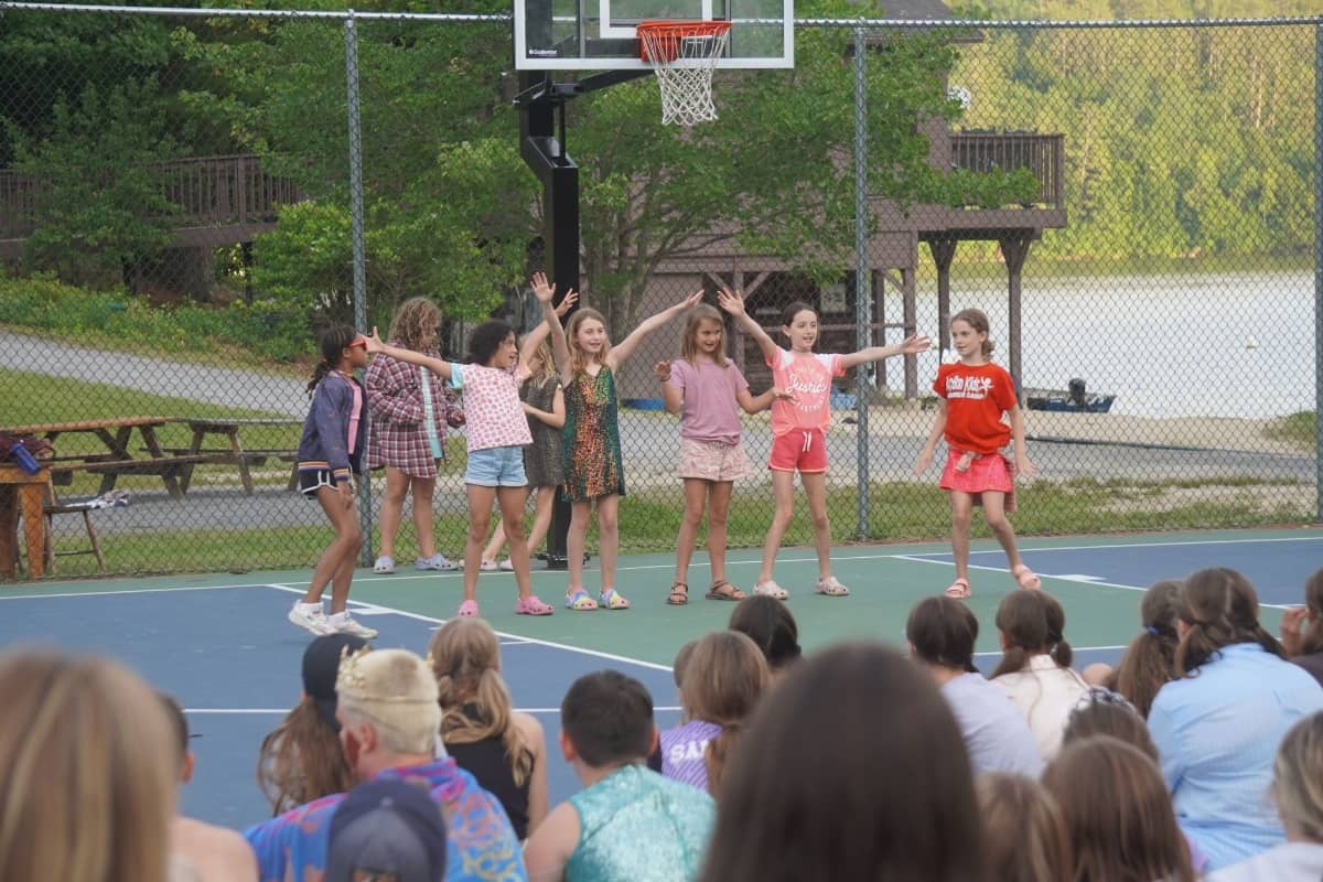 Girls performing on basketball court at Camp Billings
