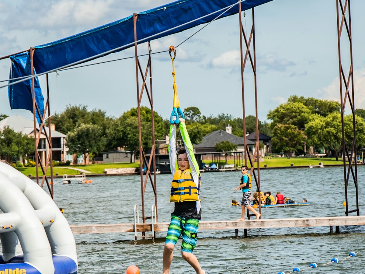 Child water zip lining at Camp Champions