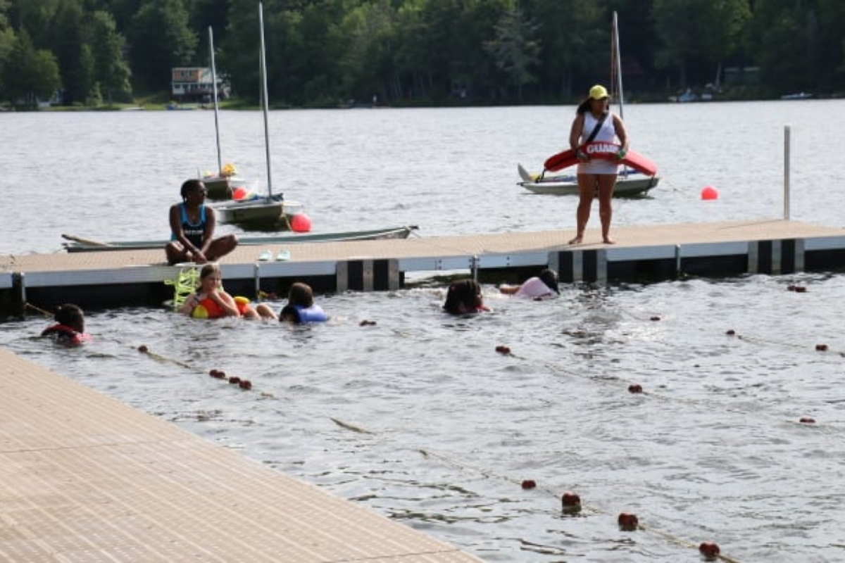 Girls playing on water at Camp Farwell