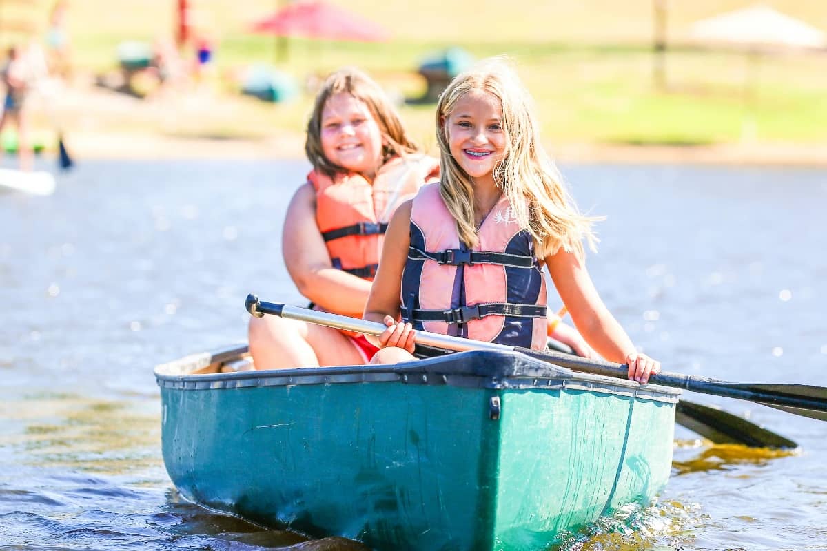 Girls paddleboarding at Camp Huawni