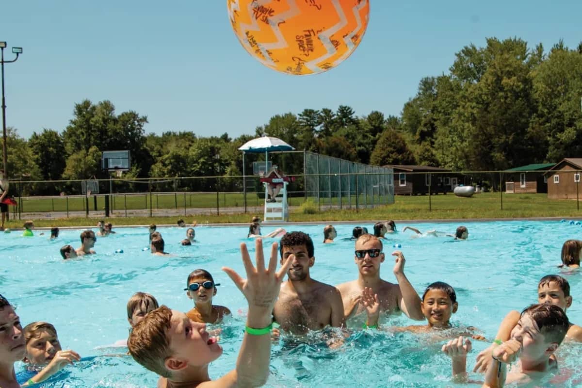Campers playing at a pool