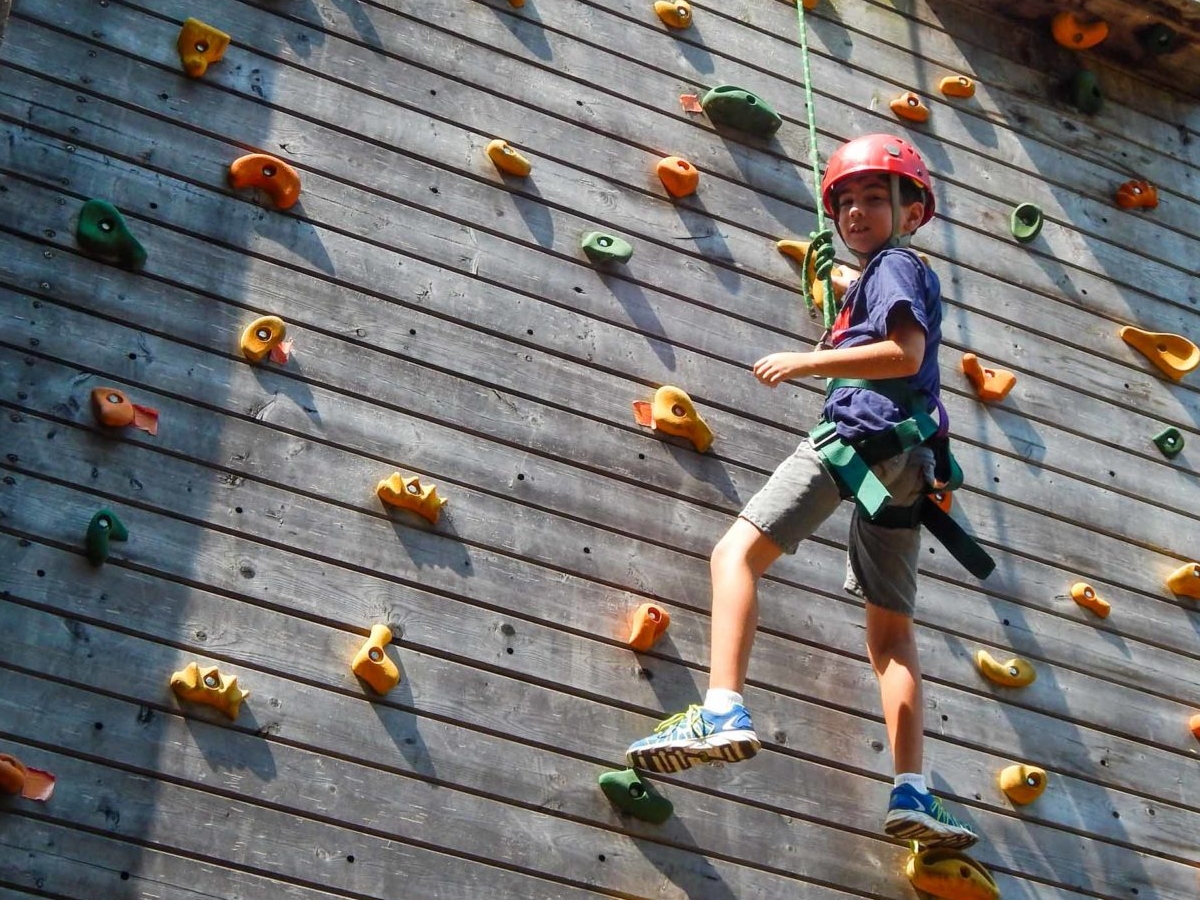 Child rock climbing at Camp Kingswood