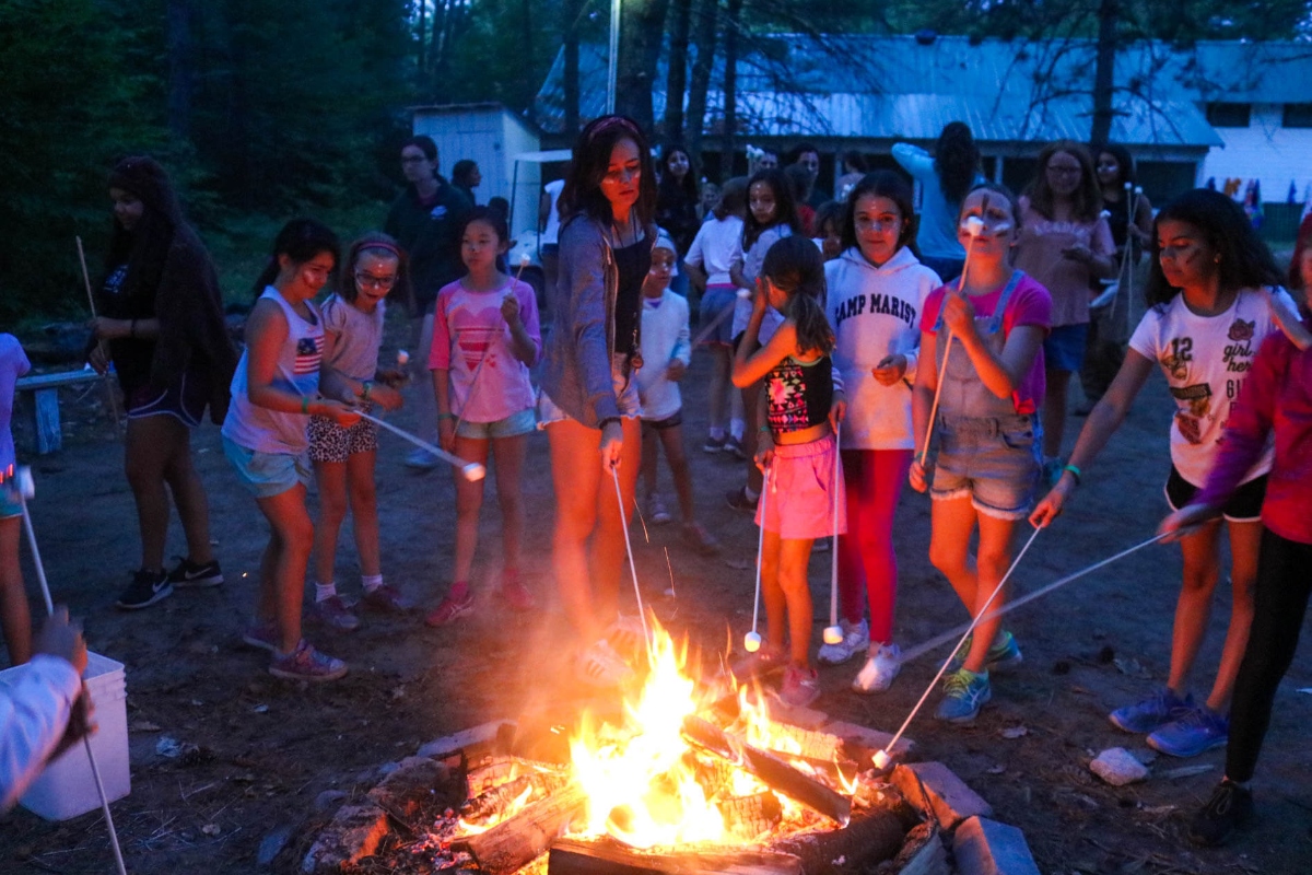 Cooking marshmellow around the campfire