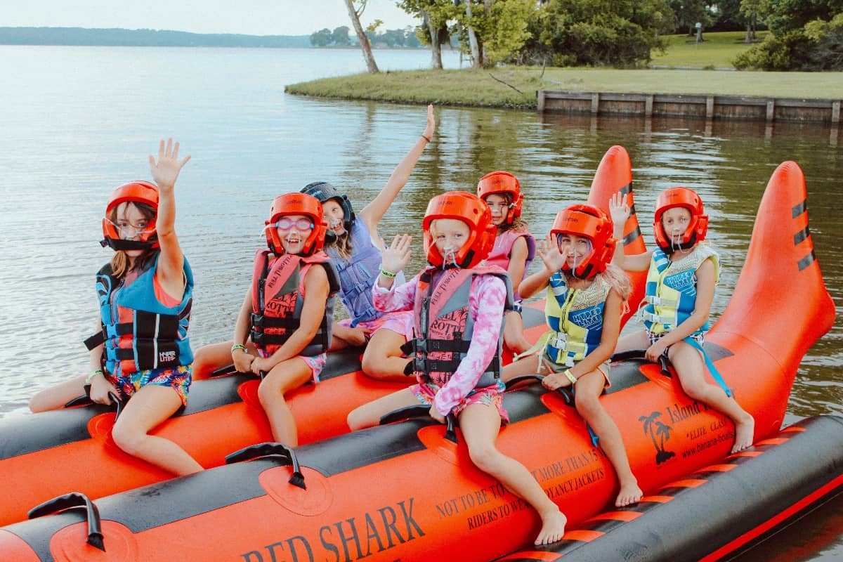 Campers going on a inflatable boat ride at Camp Olympia