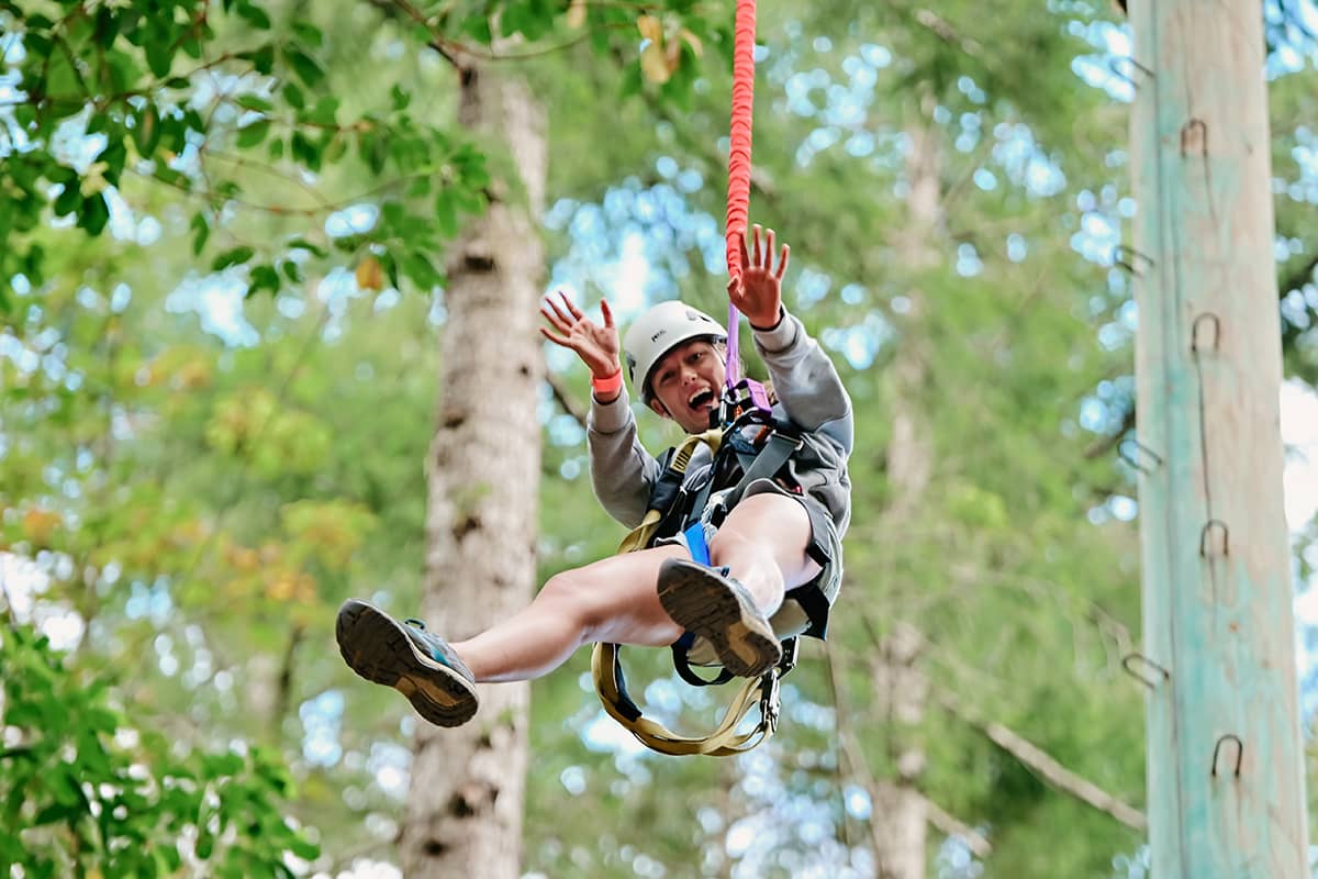 Girl going down the zipline