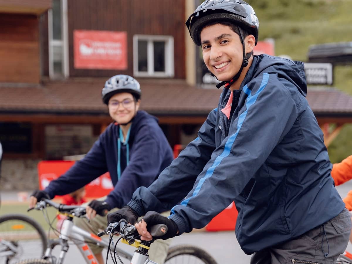 Two boys going on a bike ride