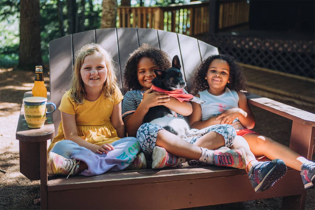 Three girls holding a puppy