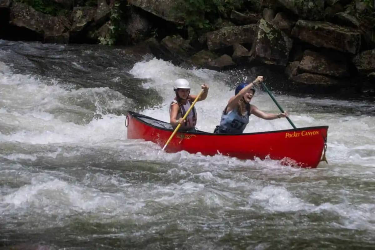 Girls canoeing at Camps Kahdalea