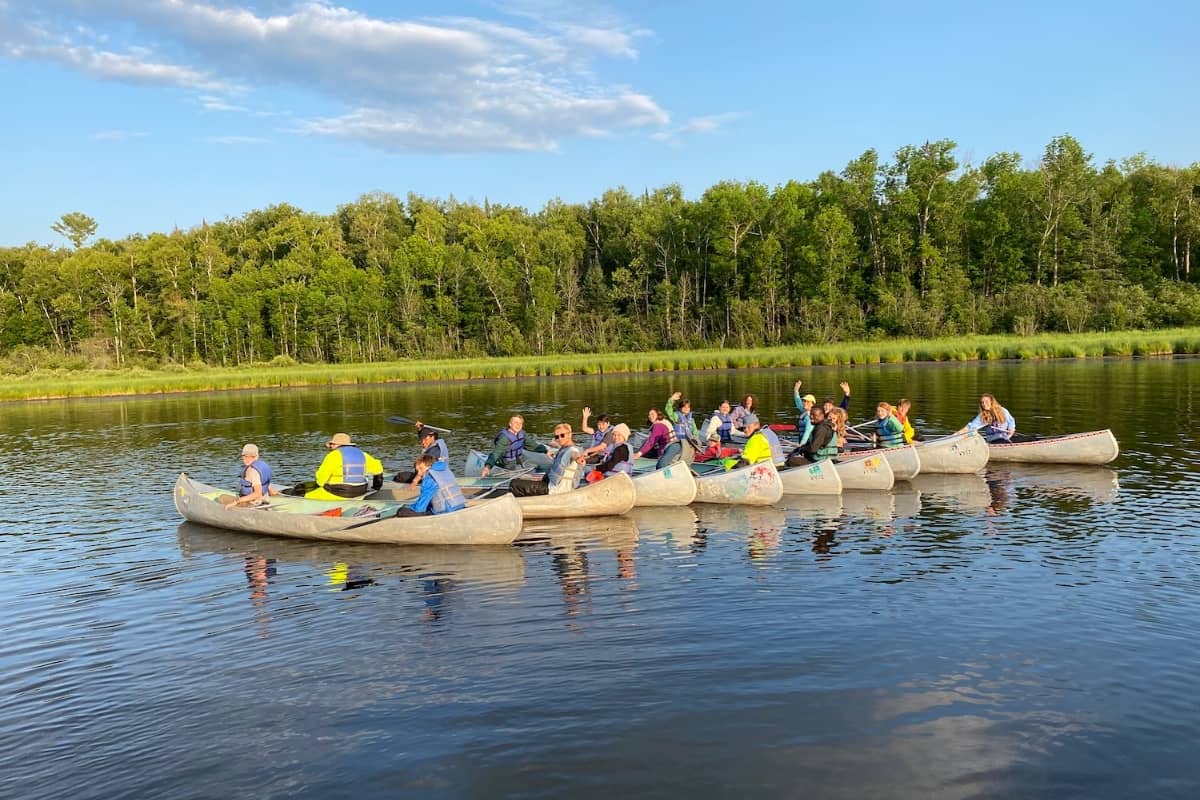 Kids going canoening in lake