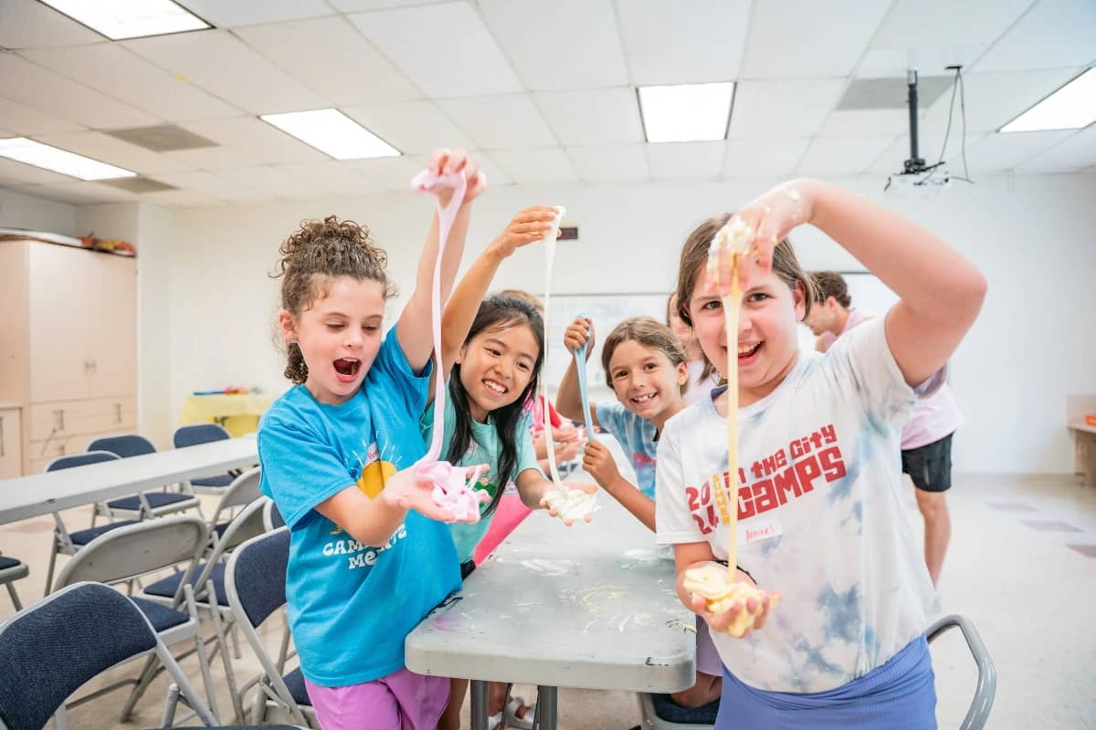 Kids playing with science at In The City Camps
