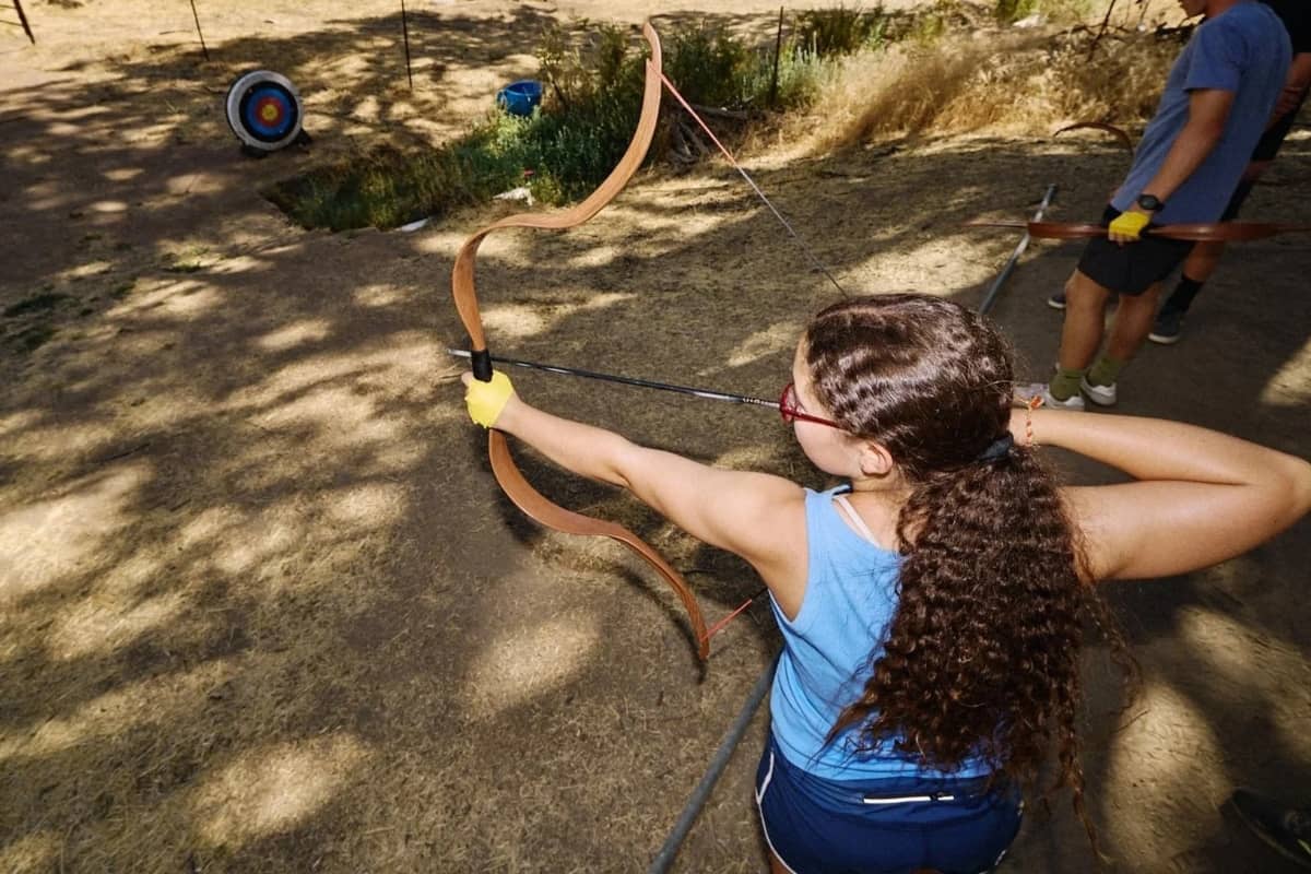 Girl doing archery at Jameson Ranch Camp