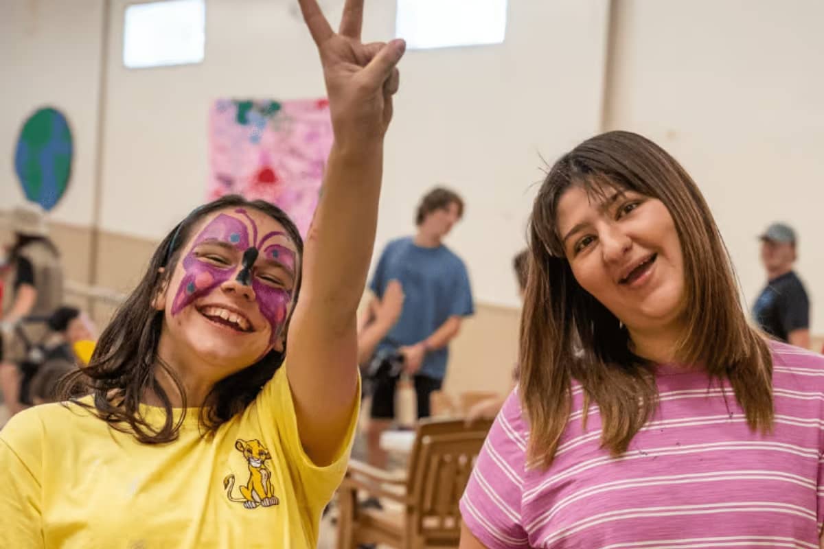 Two happy campers looking at camera