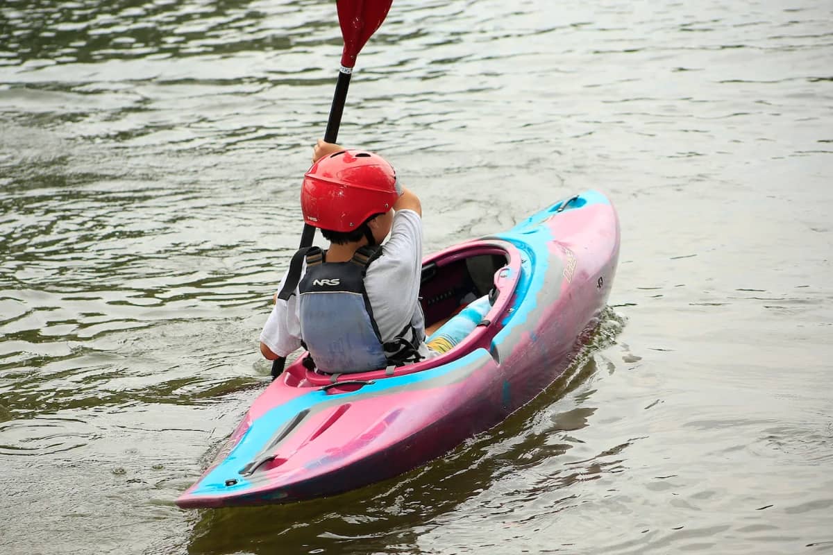 Young boy going kayaking