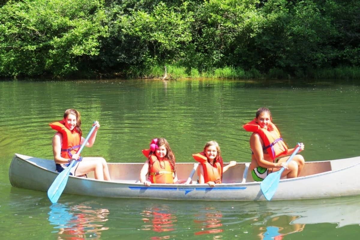 Girls going on a canoe at the lake