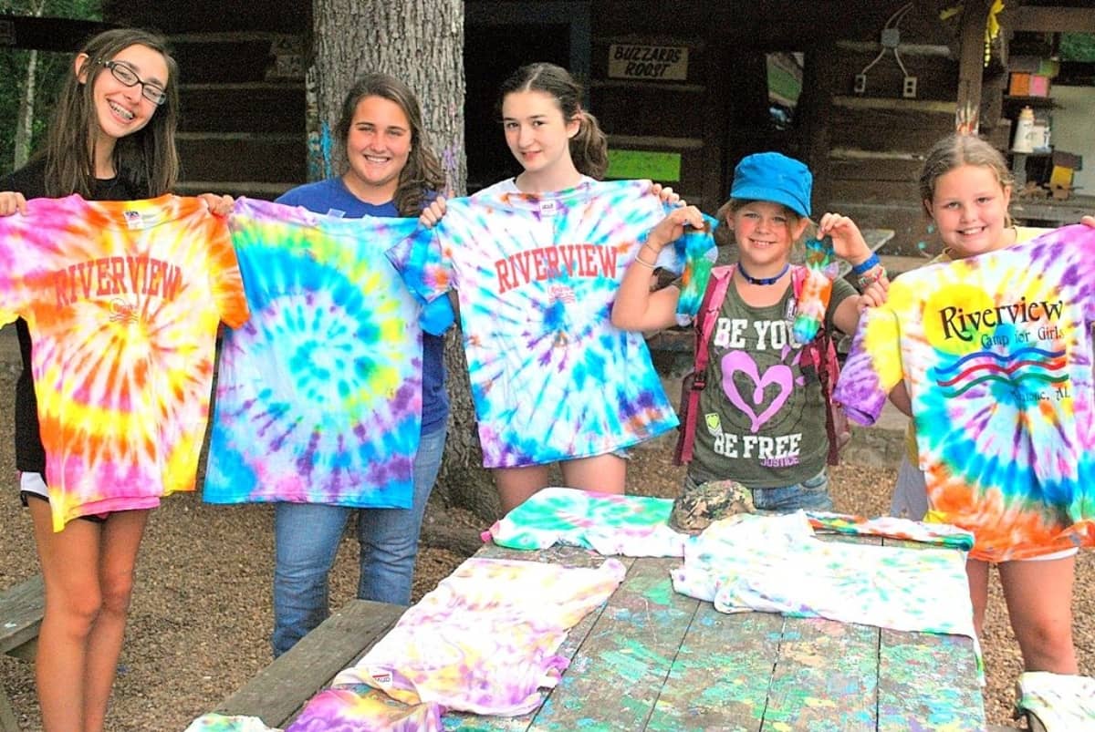 Girls painting camp shirts