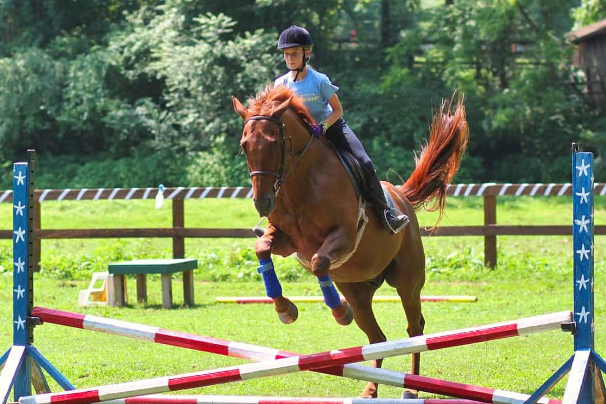 Girl horseback riding at Rockbrook Camp