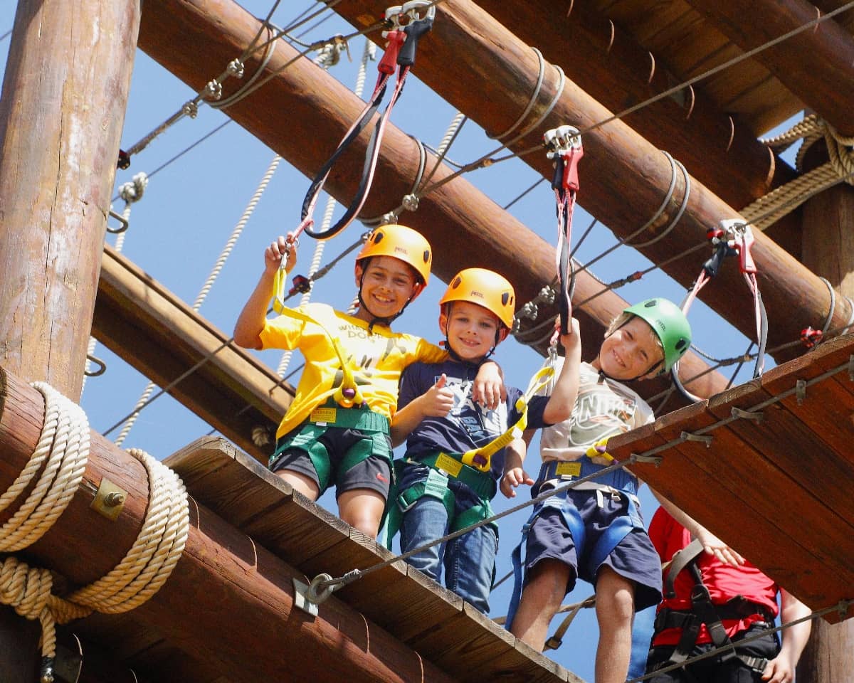 Kids on ropes course at Circle F Dude Ranch Camp