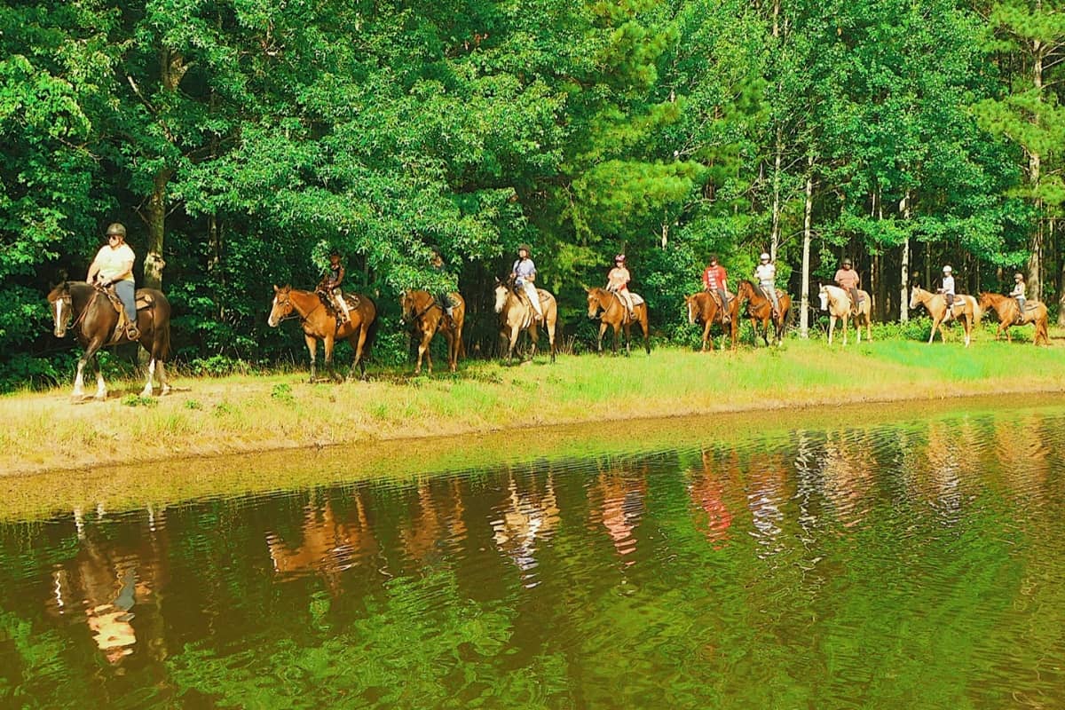 Girls horseback riding at camp