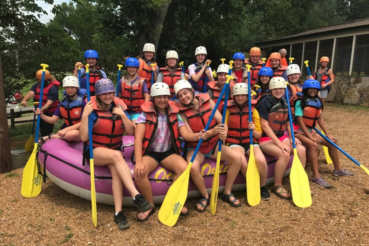 Group of campers getting ready to go water rafting