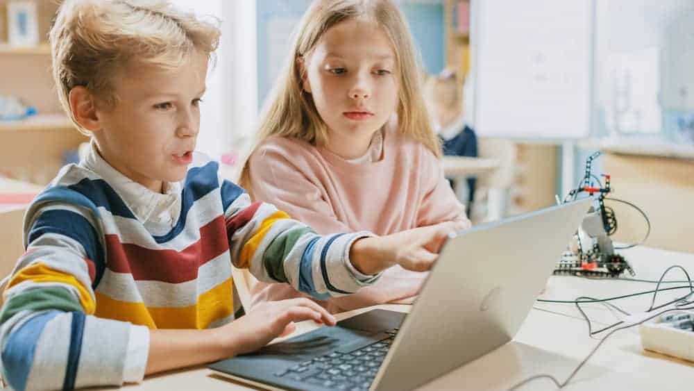 Kids coding on computer