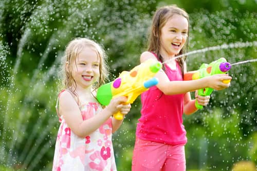 girls using water guns